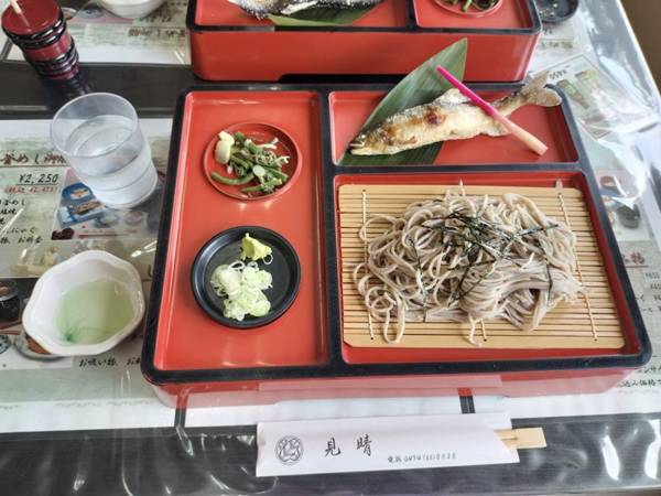 A traditional Japanese lunch set with grilled salt-cured ayu (sweetfish), zaru soba noodles, and mountain vegetable sides, served at Miharashi restaurant in Nagatoro.